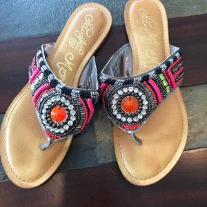 Beaded flip flops.